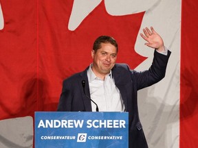 Conservative Party leader Andrew Scheer waves after giving an election-style speech at the Northern Alberta Leader’s BBQ held at Millenium Place in Sherwood Park, Alta., on July 19, 2019.