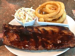 A hefty plate of baby back ribs is one of the offerings at Scotsman's Well pub.