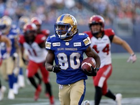 Winnipeg Blue Bombers return ace Janarion Grant runs back a punt for his first of two touchdowns against the Calgary Stampeders in Winnipeg on Aug. 8, 2019.