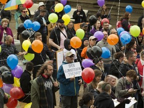 Protestors rally outside the Alberta Legislature in support of banning conversion therapy.