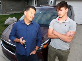 Renato Barros and his 16-year-old son Lucas pose for a photo in their driveway. Although Lucas is ready to take his drivers license examination, there are no available times in Calgary until November. Wednesday, August 28, 2019. Brendan Miller/Postmedia