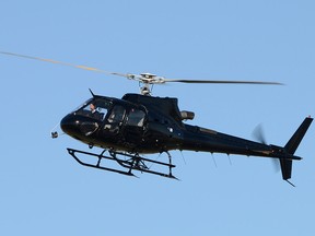 The helicopter alleged to be at the centre of an alleged international drug smuggling attempt is pictured taking off at Vancouver International Airport in 2013.