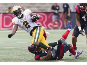 CP-Web.  Montreal Alouettes Patrick Levels, bottom, tackles Edmonton Eskimos' C.J. Gable during first half CFL football action in Montreal, Saturday, July 20, 2019.