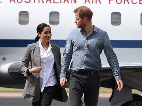 Eco-warrior Prince Harry and his wife Meghan, the Duchess of Sussex have been criticized for taking four private jet planes over the past 11 days. DEAN LEWINS/AFP/Getty Images