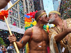 A couple kiss during the NYC Pride March on June 30, 2019 in New York City. (Kena Betancur/Getty Images)