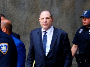 Movie producer Harvey Weinstein (C) exits after his appearance in criminal court on sexual assault charges on July 11, 2019 in New York City. Weinstein is facing rape and sexual assault charges from two separate incidents.