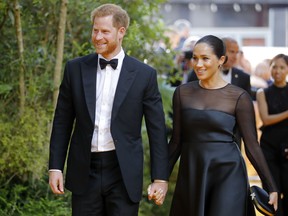 Prince Harry, the Duke of Sussex, and Meghan, the Duchess of Sussex, arrive for the European premiere of the film The Lion King in London on July 14, 2019. (TOLGA AKMEN/AFP/Getty Images)
