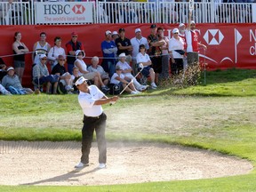 Canadian David Morland IV of Ontario, clears out of the bunker on the 18th during the New Zealand PGA Championship at Clearwater Golf Club in Christchurch, New Zealand, Sunday, Feb. 25, 2007. (AP Photo/NZPA, Ross Setford)