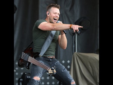 Luke Hunter, bassist with the Hunter Brothers, performs on the second day of the Country Thunder music festival, held at Prairie Winds Park in Calgary Saturday, August 17, 2019. Dean Pilling/Postmedia