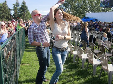 Music fans dance as the Hunter Brothers, perform on the second day of the Country Thunder music festival, held at Prairie Winds Park in Calgary Saturday, August 17, 2019. Dean Pilling/Postmedia