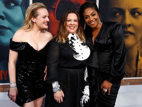 Cast members Elisabeth Moss, Melissa McCarthy and Tiffany Haddish attend the premiere for "The Kitchen" in Los Angeles. REUTERS/Mario Anzuoni