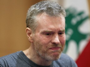 Canadian citizen Kristian Lee Baxter, who was being held in Syria, reacts during a news conference, after being released in Beirut, Lebanon Aug. 9, 2019.