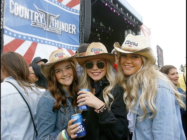 Music fans brave the cold on the first day of the Country Thunder music festival, held at Prairie Winds Park in Calgary Friday, August 16, 2019. Dean Pilling/Postmedia