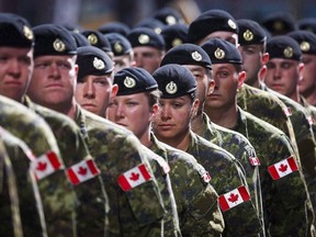 Members of the Canadian Armed Forces march during the Calgary Stampede parade in Calgary, Friday, July 8, 2016.