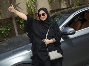 Fadya Fahad, one of the first female drivers for Careem, a peer-to-peer ride sharing company similar to Uber, poses for a photo next to a car she has rented on the first day she is legally allowed to drive in Saudi Arabia on June 24, 2018 in Jeddah, Saudi Arabia.