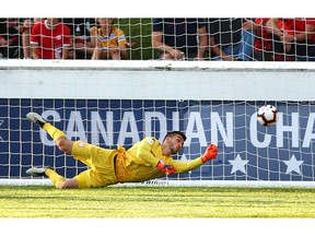 Cavalry FC Keeper Marco Carducci stretches for a ball on Montreal Impact's first goal during Canadian Championship soccer action between the Montreal Impact and Cavalry FC at ATCO Field at Spruce Meadows in Calgary on Wednesday. Photo by Jim Wells/Postmedia.