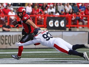 Calgary Stampeders' quarterback Nick Arbuckle was under pressure from the Montreal Alouettes' Antonio Simmons during CFL action at McMahon Stadium in Calgary on Saturday August 17, 2019.  Gavin Young/Postmedia