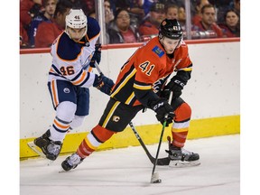 Calgary Flames Matthew Phillips and Edmonton Oilers Steve Iacobellis fight for the possession of the puck during the battle of Alberta prospects game at Scotiabank Saddledome in Calgary on Tuesday, September 10, 2019. Azin Ghaffari/Postmedia Calgary