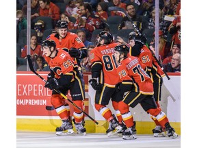 The Calgary Flames celebrate a goal by Adam Ruzicka against the Edmonton Oilers during the Battle of Alberta prospects game at Scotiabank Saddledome in Calgary on Tuesday night. Photo by Azin Ghaffari/Postmedia.