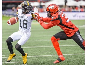 Hamilton Tiger-Cats Brandon Banks gets pushed out of the field by Calgary Stampeders Tre Roberson during the regular season action at McMahon Stadium in Calgary on Saturday, September 14, 2019. Azin Ghaffari/Postmedia Calgary
