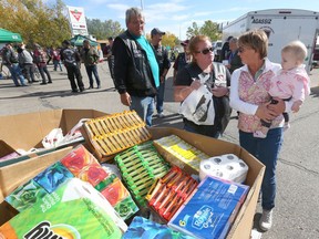 Veterans and volunteers drop off and collect donations at the Veterans Association Food Bank "Food Drive and Fund Raiser" at the Canadian Tire in northwest Calgary on Saturday, September 21, 2019. Jim Wells/Postmedia