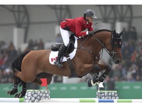 LIMA, PERU - AUGUST 07: Erynn Ballard of Canada riding Fellini S competes during equestrian Jumping Team at Army Equestrian School on Day 12 of Lima 2019 Pan American Games on August 7, 2019 in Lima, Peru.