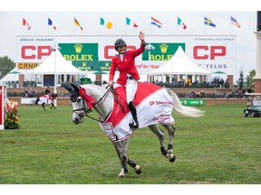 CALGARY, AB - SEPTEMBER 08: Beezie Madden takes a victory lap while riding Darry Lou during the Spruce Meadows Masters, part of the Rolex Grand Slam of Show Jumping at Spruce Meadows on September 8, 2019 in Calgary, Canada.