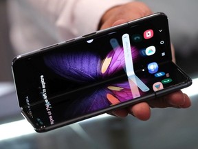 A stand host displays the new Samsung Galaxy Fold smartphone at the 2019 IFA home electronics and appliances trade fair on September 05, 2019 in Berlin, Germany. The 2019 IFA fair will be open to the public from September 6-11.