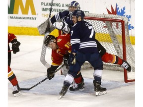 Men's UCalgary Dinos, Tim Vanstone battles MRU Cougars', Jesse Lees in second period action as the Calgary Flames hosted the Crowchild Classic at the Scotiabank Saddledome on. The on-ice contests will feature the women's and men's hockey teams from the University of Calgary and Mount Royal University in back-to-back action. This double header is a part of the Crowchild Classic series, an ongoing contest between the two universities on Tuesday January 29, 2019. Darren Makowichuk/Postmedia