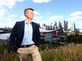 Calgary Coun Jeromy Farkas stands overlooking the city skyline in a file photo.