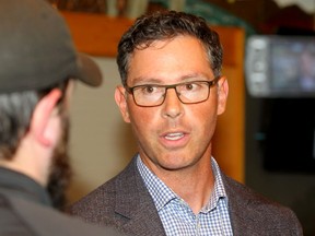 Justice Minister Doug Schweitzer is seen speaking to reporters during a tour throughout rural Alberta talking about rural crime at the Bragg Creek Community Centre. Thursday, September 5, 2019.