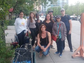 Transgender professor Chris Macnab said the University of Calgary put her safety at risk after mismanaging a social media post about her transition. Here Macnab, centre, is pictured with volunteers during her weekly efforts to help Calgary's homeless population with #BeTheChangeYYC.