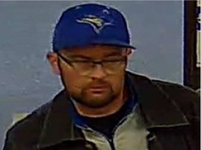 Calgary police are trying to identify a person of interest in connection with a home invasion in south part of the city. They are described as Caucasian, with brown hair and a beard. They were wearing eye glasses, a blue baseball cap, a dark coloured jacket and a blue and white shirt. (Calgary police)