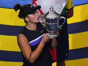 Bianca Andreescu of Canada poses with her trophy after she won against Serena Williams of the US the Women's Singles Finals match at the 2019 US Open at the USTA Billie Jean King National Tennis Center in New York on September 7, 2019.