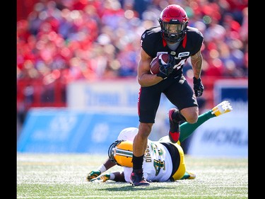 Calgary Stampeders Reggie Begelton avoids a tackle by Vontae Diggs of the Edmonton Eskimos during CFL football in Calgary on Monday, September 2, 2019. Al Charest/Postmedia