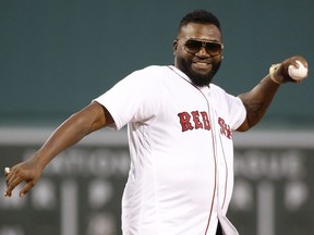 Former Boston Red Sox player David Ortiz throws out the first pitch before the game between against the New York Yankees at Fenway Park. Mandatory Credit: Greg M. Cooper-USA TODAY Sports ORG XMIT: USATSI-399602