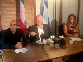 Toufik Benhamiche, left to right, Bloc Quebecois MP Luc Theriault and Kahina Bensaadi, Toufik's wife, answer reporters questions in Mascouche, Que., Friday, Sept. 6, 2019.