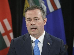 Alberta Premier Jason Kenney speaks to media during the Western Premiers' conference in Edmonton on June 27, 2019. Kenney is encouraging United Conservative legislature members to help oust Justin Trudeau's Liberals in the Oct. 21 federal election.