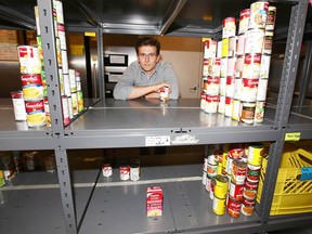 Adrian Handy, University of Calgary Students' Union Campus Food Bank co coordinator stands among the dwindling supply at the University food bank Wednesday, September 25, 2019. The organization is in dire need of donations due to increased demand. Jim Wells/Postmedia