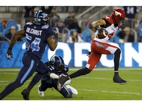 CP-Web.  Toronto Argonauts defensive back Abdul Kanneh (14) misses a tackle on Calgary Stampeders wide receiver Eric Rogers (4) during first half of CFL action in Toronto, Friday, Sept. 20, 2019.
