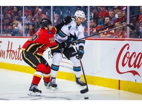 Sep 18, 2019; Calgary, Alberta, CAN; San Jose Sharks defenseman Brenden Dillon (4) and Calgary Flames center Dillon Dube (29) battle for the puck during the first period at Scotiabank Saddledome. Mandatory Credit: Sergei Belski-USA TODAY Sports ORG XMIT: USATSI-406631