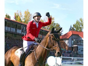 Belgium's Francois Jr Mathy celebrates on his mount Uno De La Roque after clinching the gold medal in the second round of the BMO Nations' Cup in the International Ring during The Masters show jumping event at Spruce Meadows in Calgary on Saturday, September 7, 2019. Jim Wells/Postmedia