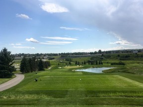 Cutline: Hole 14 of Wes Gilbertson's Awesome 18 — a knee-knocking Par-3 on the Talons Course at Country Hills Golf Club. (Wes Gilbertson/Postmedia)