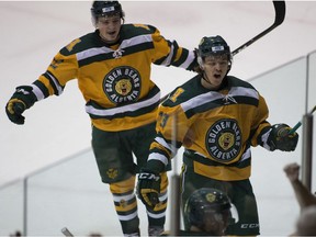 University of Alberta Golden Bears Luke Philp 12) and Steven Owre (13) celebrate a goal scored on University of Saskatchewan Huskies goalie Taran Kozun during Canada West Men's hockey final action on Friday, March 2, 2018  in Edmonton. Greg  Southam / Postmedia Photos for copy in Saturday, March 3 edition