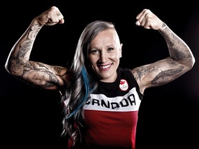 Two-time Olympic gold medalist Kaillie Humphries poses for photos during Team Canada's Olympic Summit at the Telus Convention Centre in Calgary on Sunday, June 4, 2017. (Leah Hennel/Postmedia)