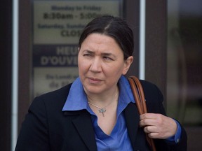 RCMP Const. Shelly Mitchell leaves the court house in Moncton, N.B. on Tuesday, May 9, 2017. Four RCMP officers, including Mitchell, who responded to the 2014 shootings in Moncton that claimed the lives of three of their colleagues are suing the Attorney General of Canada for negligence.