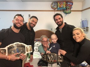 Myself, Finn Balor, Roman Reigns, and Seth Rollins visiting Rocco and presenting him with his own WWE Championship belt at the Pittsburgh Children’s Hospital in March 2019.