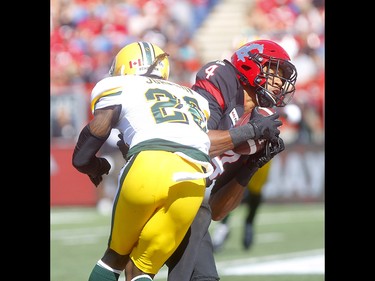 Calgary Stampeders, Eric Rogers makes a catch with Edminton Eskimos, Josh Johnson on him in first half action of the Labour Day classic at McMahon stadium in Calgary on Monday, September 2, 2019. Darren Makowichuk/Postmedia