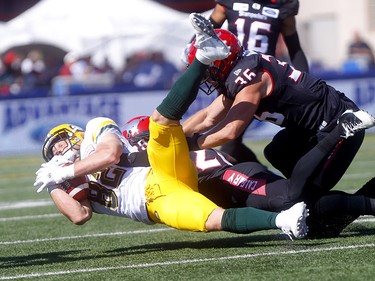 Calgary Stampeders, Brandon Smith stops Edminton Eskimos, Greg Ellingson in first half action in the Labour Day classic at McMahon stadium in Calgary on Monday, September 2, 2019. Darren Makowichuk/Postmedia