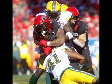 Calgary Stampeders, Terry Williams is stopped by Edmonton Eskimos, Monshadrik Hunter in second half action in the Labour Day classic at McMahon stadium in Calgary on Monday, September 2, 2019. Darren Makowichuk/Postmedia